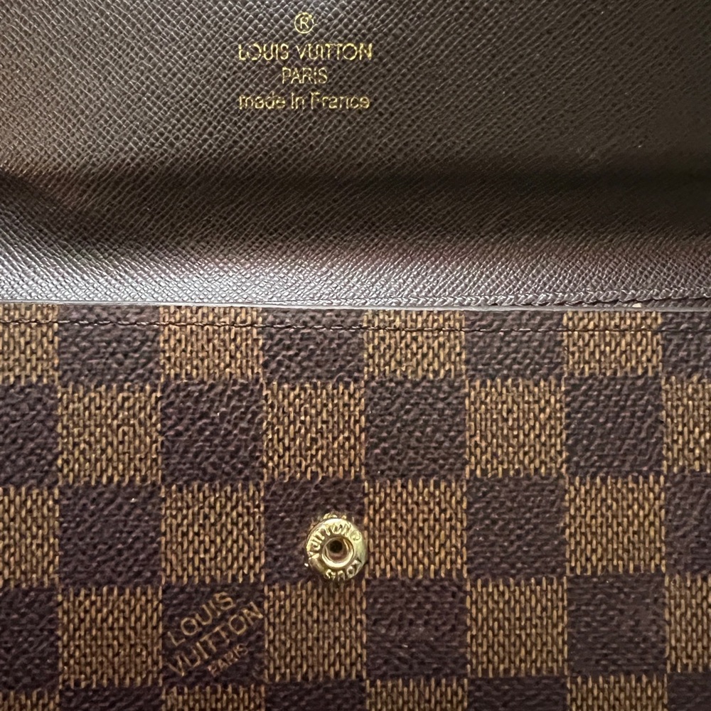 Authentic Louis Vuitton, wallet. In great condition, but missing a snap.